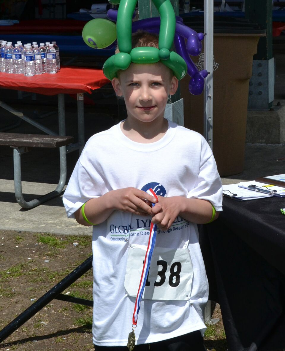 Glastonbury's Evan Lionberger, 9, was the top 5k male finisher in the "age 9 and under" group.