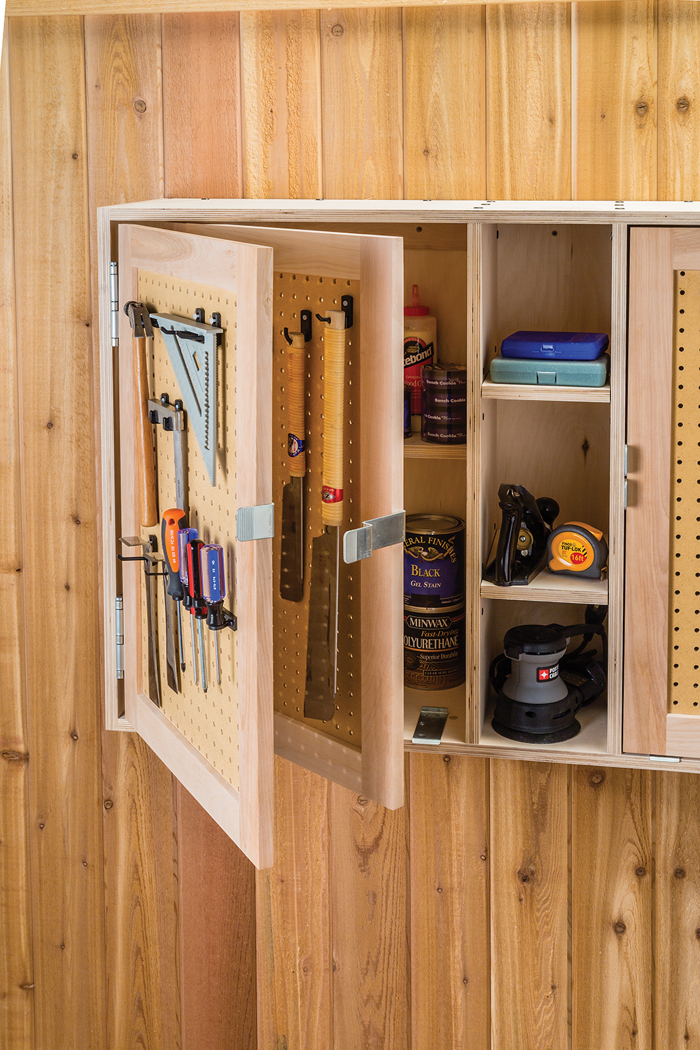 Using pegboard in the door panels effectively doubles the hanging storage capacity of cabinet doors.