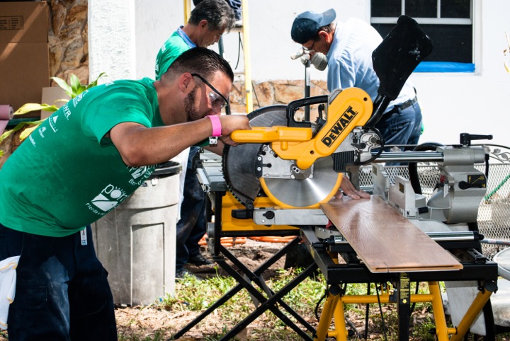 Home repair and restoration experts from Rapid Response Team work on repairs for low-income homeowners during National Rebuilding Day on April 25.