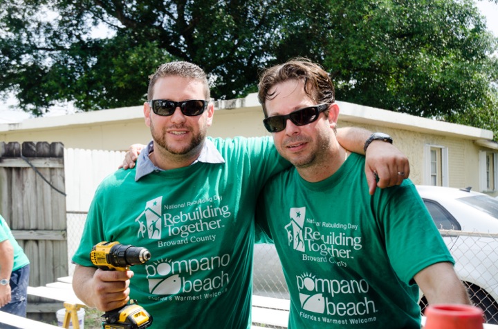 Restoration specialists from Rapid Response Team help out with a neighborhood makeover of more than 15 homes during National Rebuilding Day.