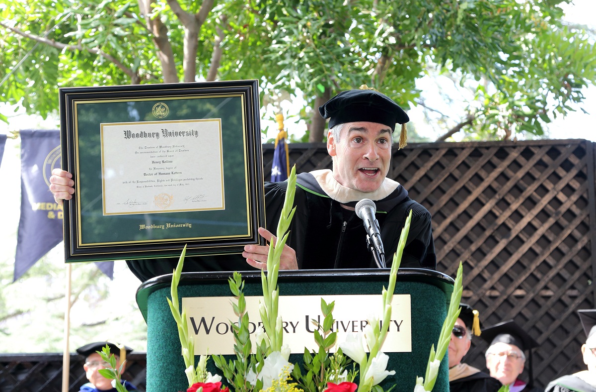 Rollins brandishing honorary Doctorate of Letters