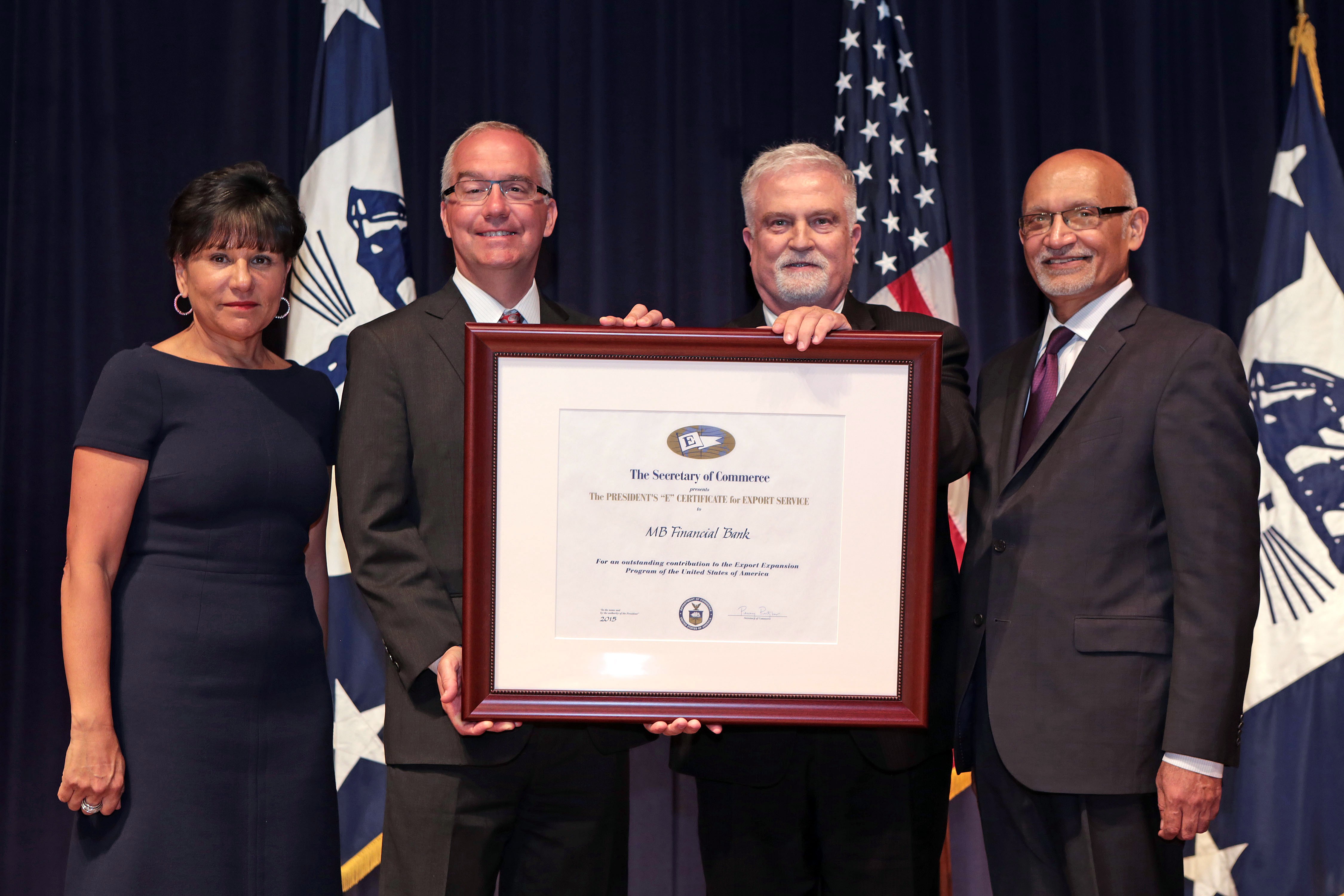 Commerce Secretary Penny Pritzker presents the 2015 President’s “E” Award for export services to MB Financial Bank, one of only two banks in the country receiving this recognition.