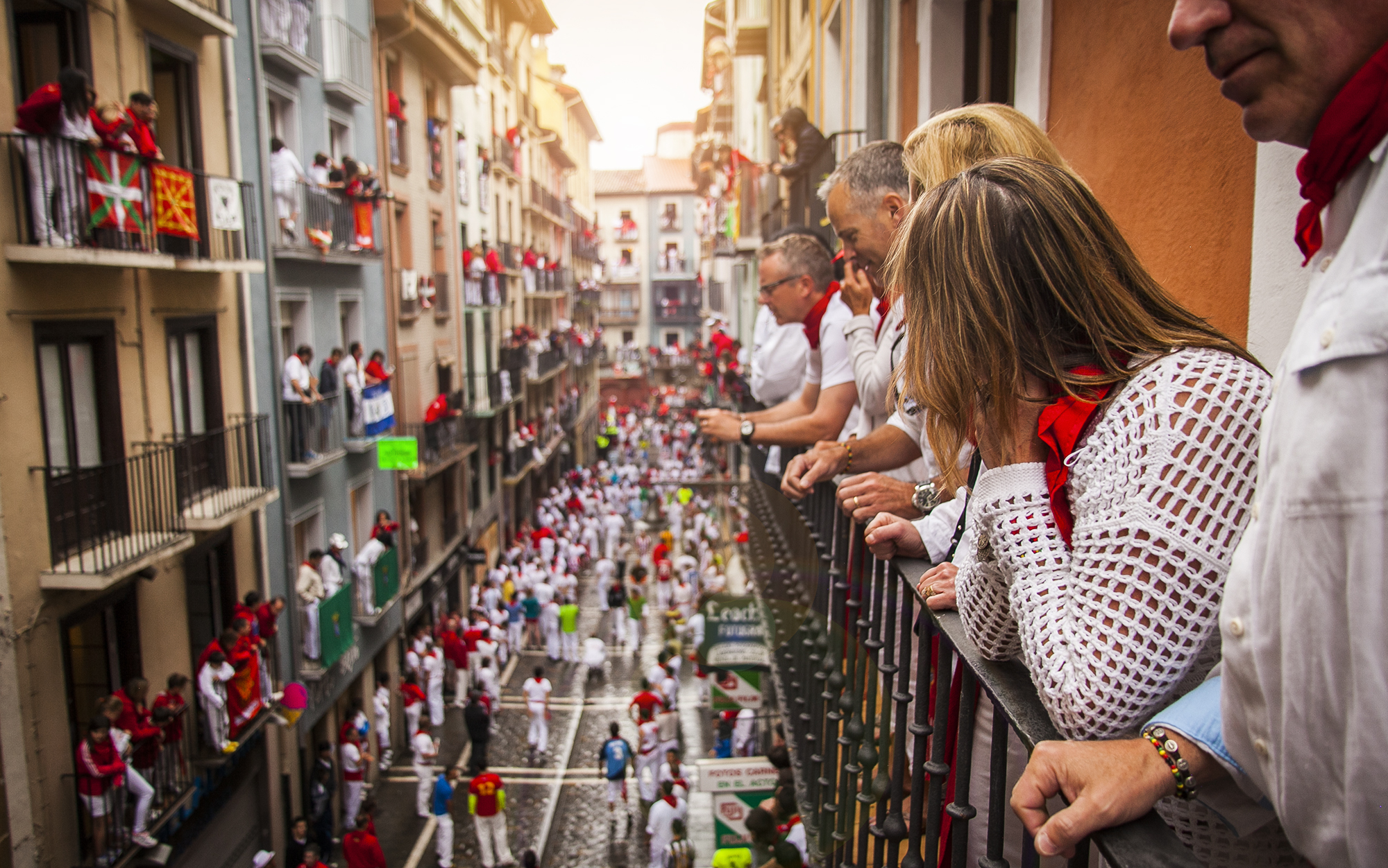 Guests viewing the Running of the Bulls from a balcony