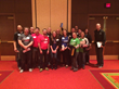 Nearly 20 Clickstop employees gather for a photo following the CBJ's 25 Fastest Growing Companies awards breakfast at the Coralville Marriott on Tuesday, May 19, 2015.