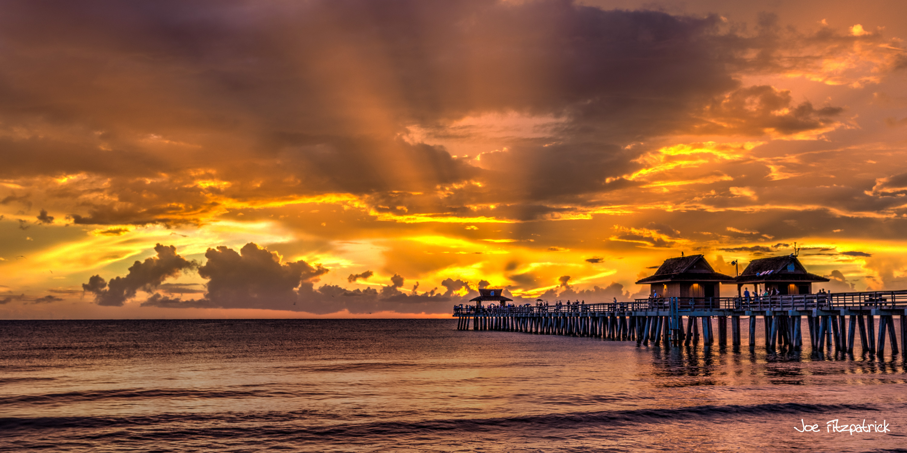 Sunset photo of Naples pier by Joe Fitzpatrick