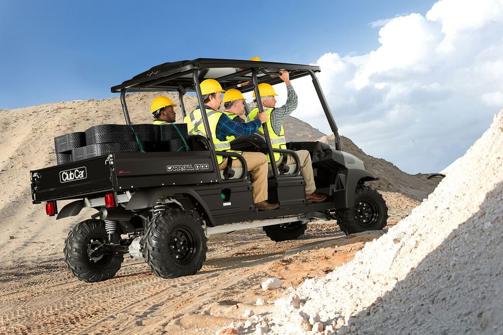 The rental-ready Carryall 1700 utility vehicle carries two crews and their gear with a cargo bed for an air compressor or other equipment.