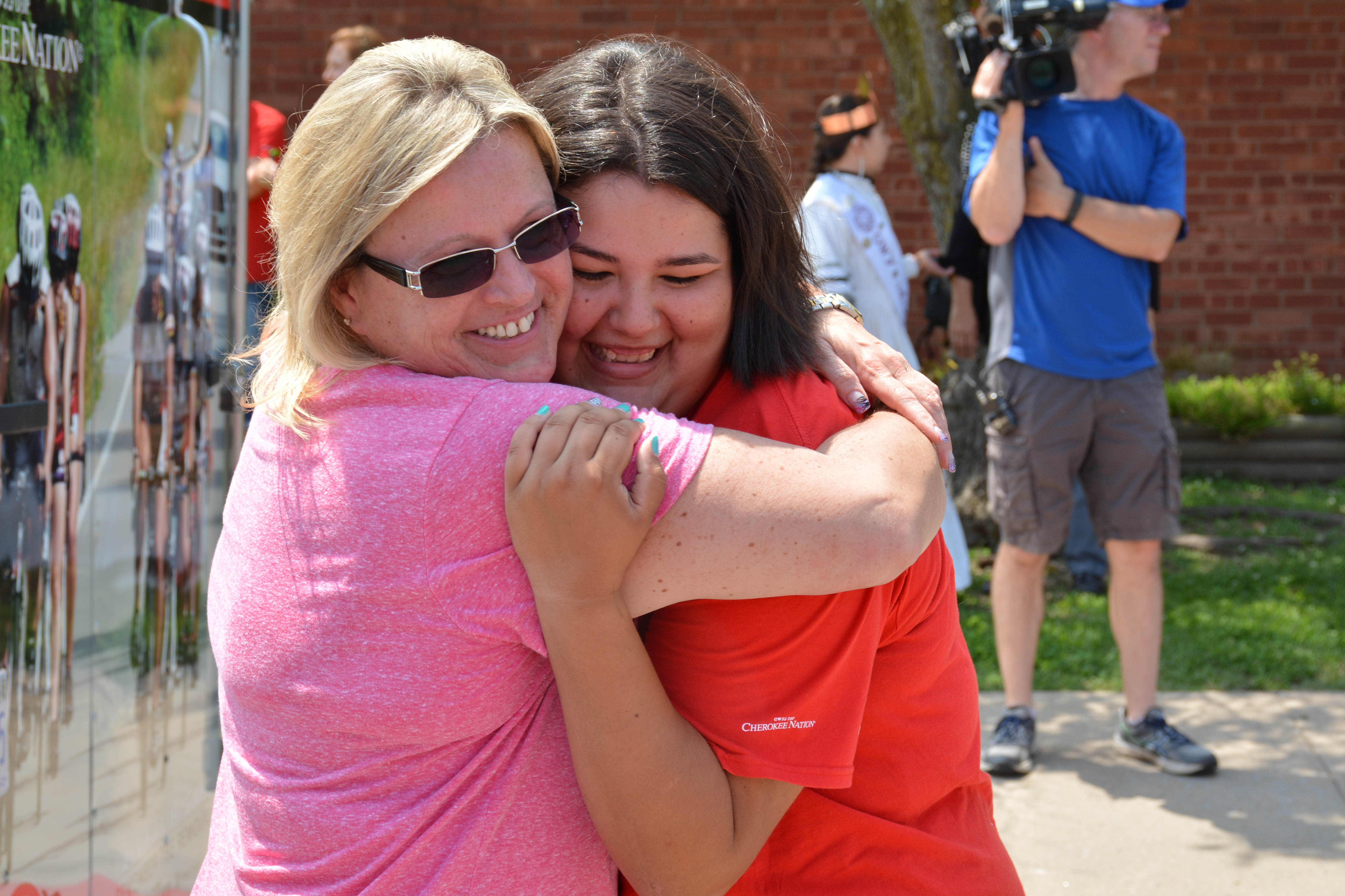 Mother Lisa Caviness hugs daughter and 2015 Remember the Removal Bike Ride participant Haylee Caviness before the group left to begin three-week journey.