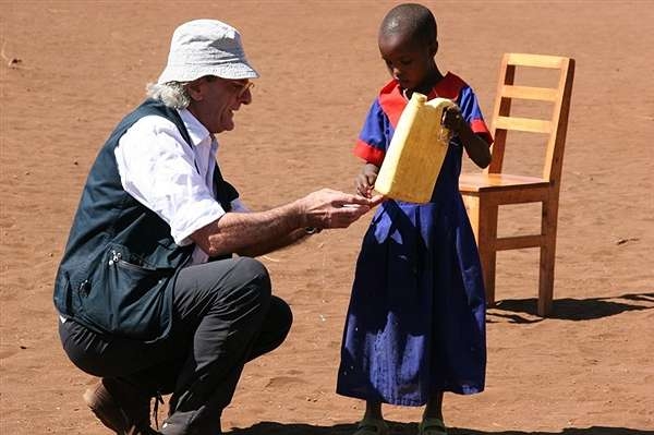 Human Rights Hero Maurizio de Romedis, who was honored at the Eighth Annual Human Rights Hero Awards on May 8, visits with a young villager. (Photo courtesy of ilvescovado.it)