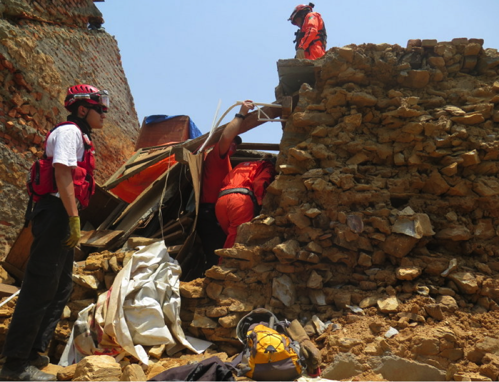 Los Topos and CINAT members enter the significantly damaged temple in Kathmandu on May 24 on an operation to salvage precious artifacts trapped beneath the structure’s collapsing roof.