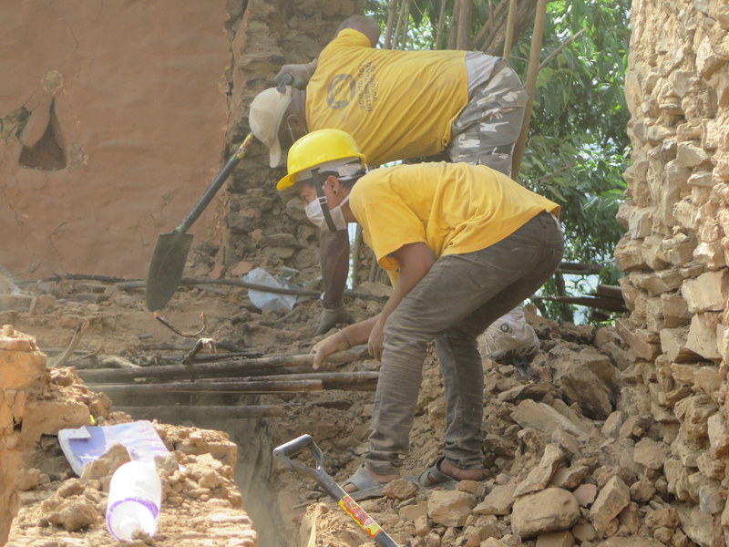 Scientology Volunteer Ministers lend a hand to demolish the dangerous temple walls, and leaving a stable foundation on which to rebuild.