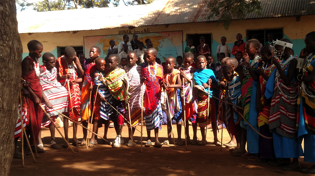 Masai students at Sanya School prepare to perform a tribal dance for visitors