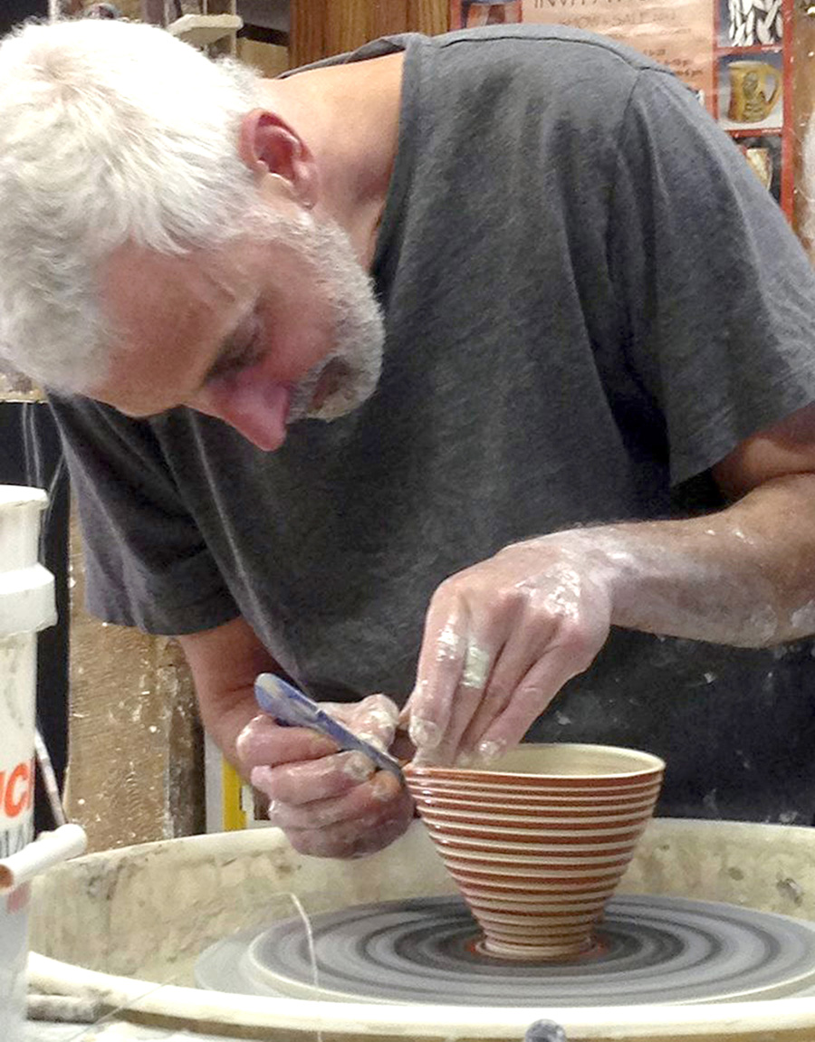 Potter Dan Bellows creates original pottery at his wheel during the Berkshires Arts Festival