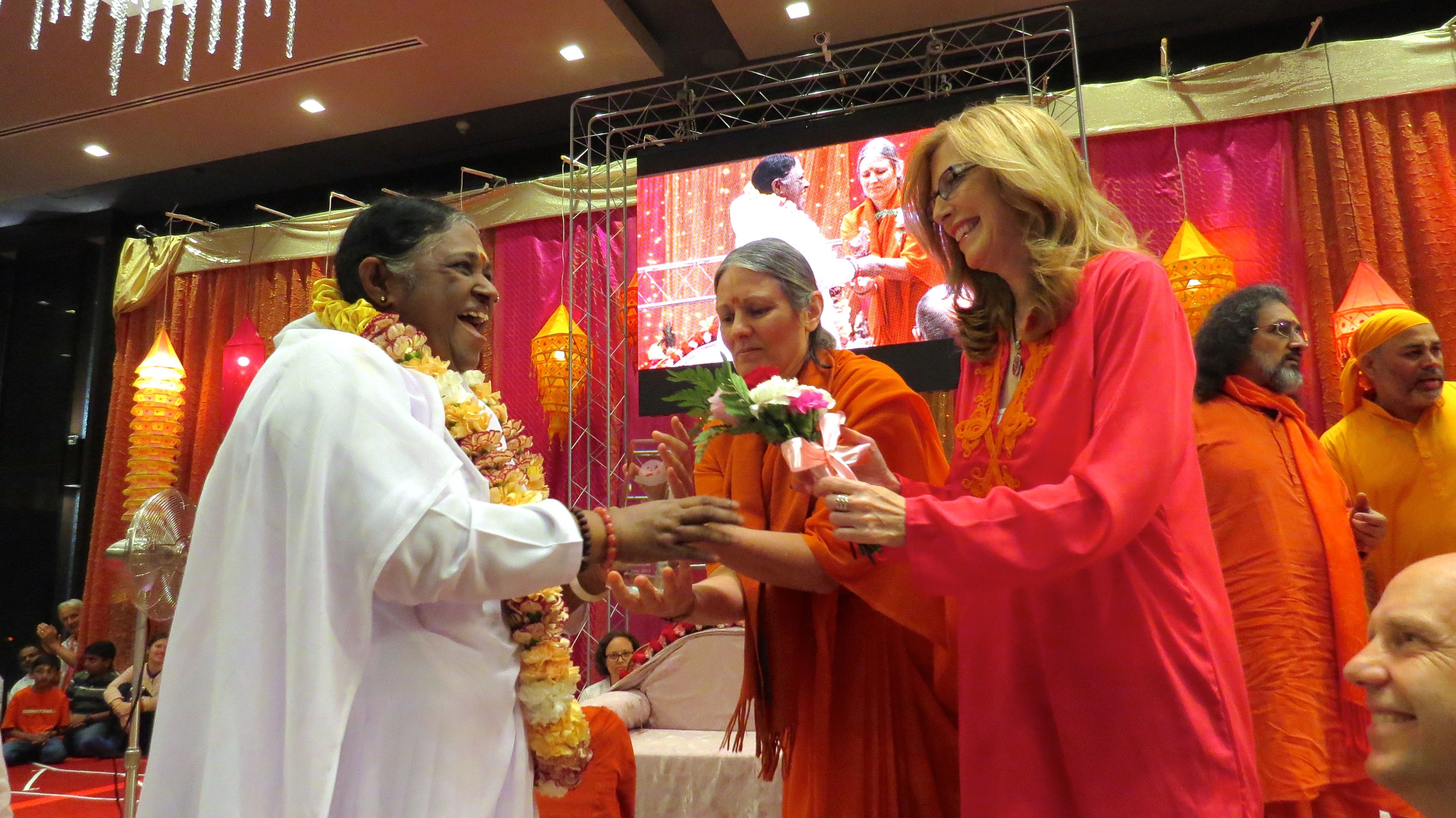 Amma "The Hugging Saint" accepts Golden Goody Award from Goody Awards Founder Liz H Kelly in Los Angeles