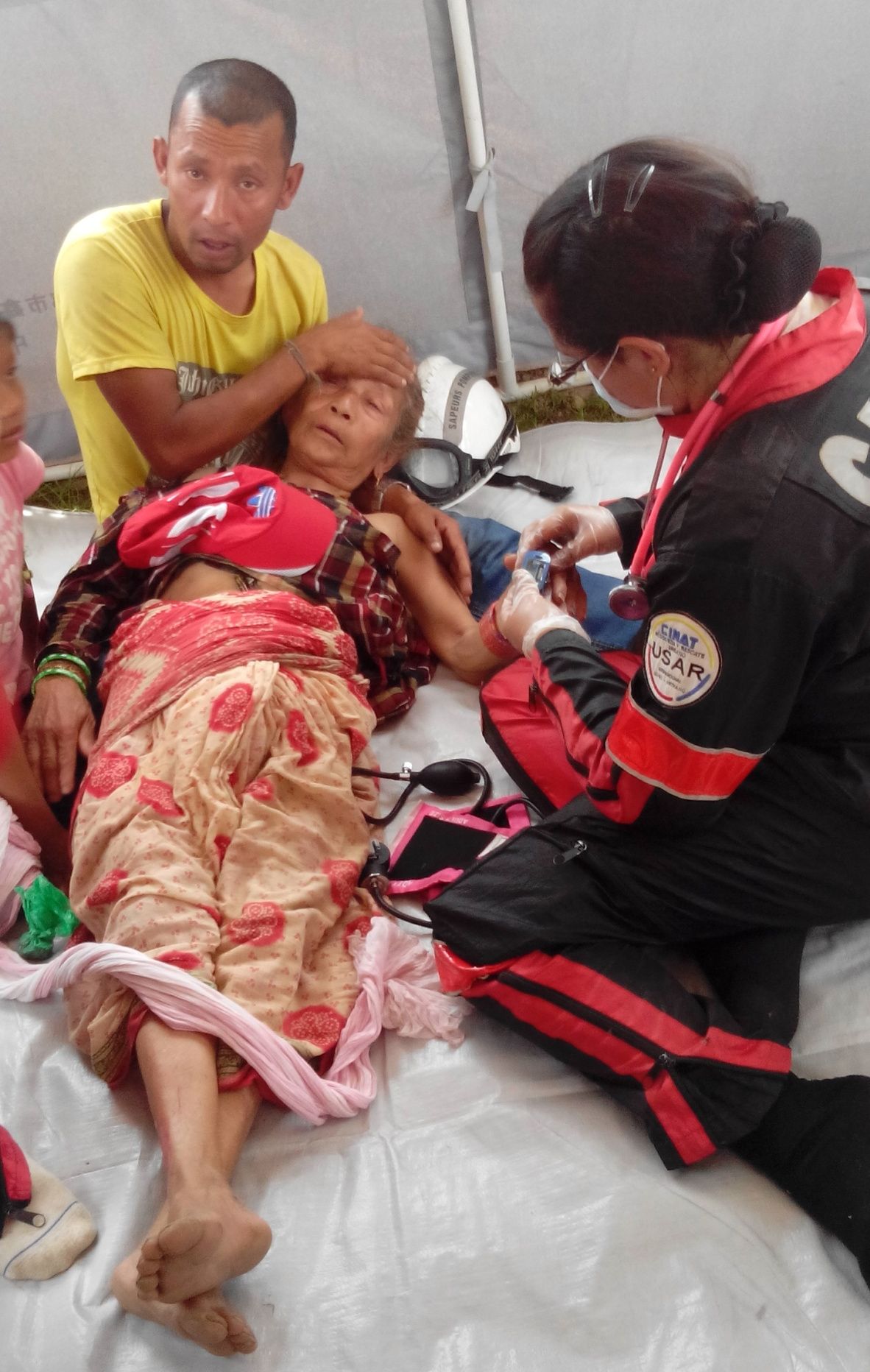 A Nepalese woman receiving first aid.