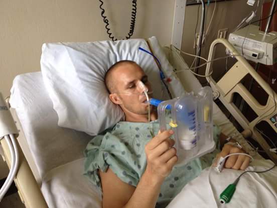 Brian Thomas in 2013 increasing his lung capacity after his surgery in the hospital.