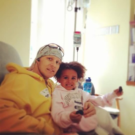 Brian receiving an infusion, gets a visit from his young daughter Gabi.