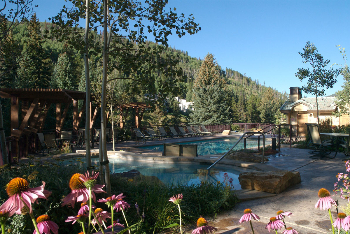 The outdoor heated pool-with-a-view at Antlers at Vail hotel features two hot tubs, and is a fabulous place to relax and take in the fresh mountain air.