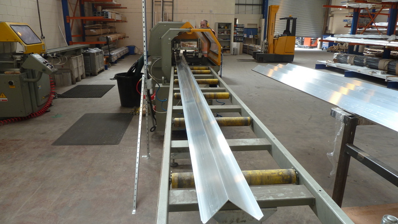 Custom Profiles Ltd's aluminium extrusion saw in operation