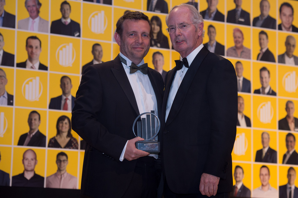 Simon Ward receiving one of his award from Sir Peter Rigby