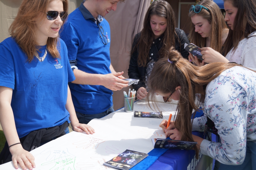 Youth for Human Rights volunteers at their “infostand” at the Sfinks Mixed Music Festival.