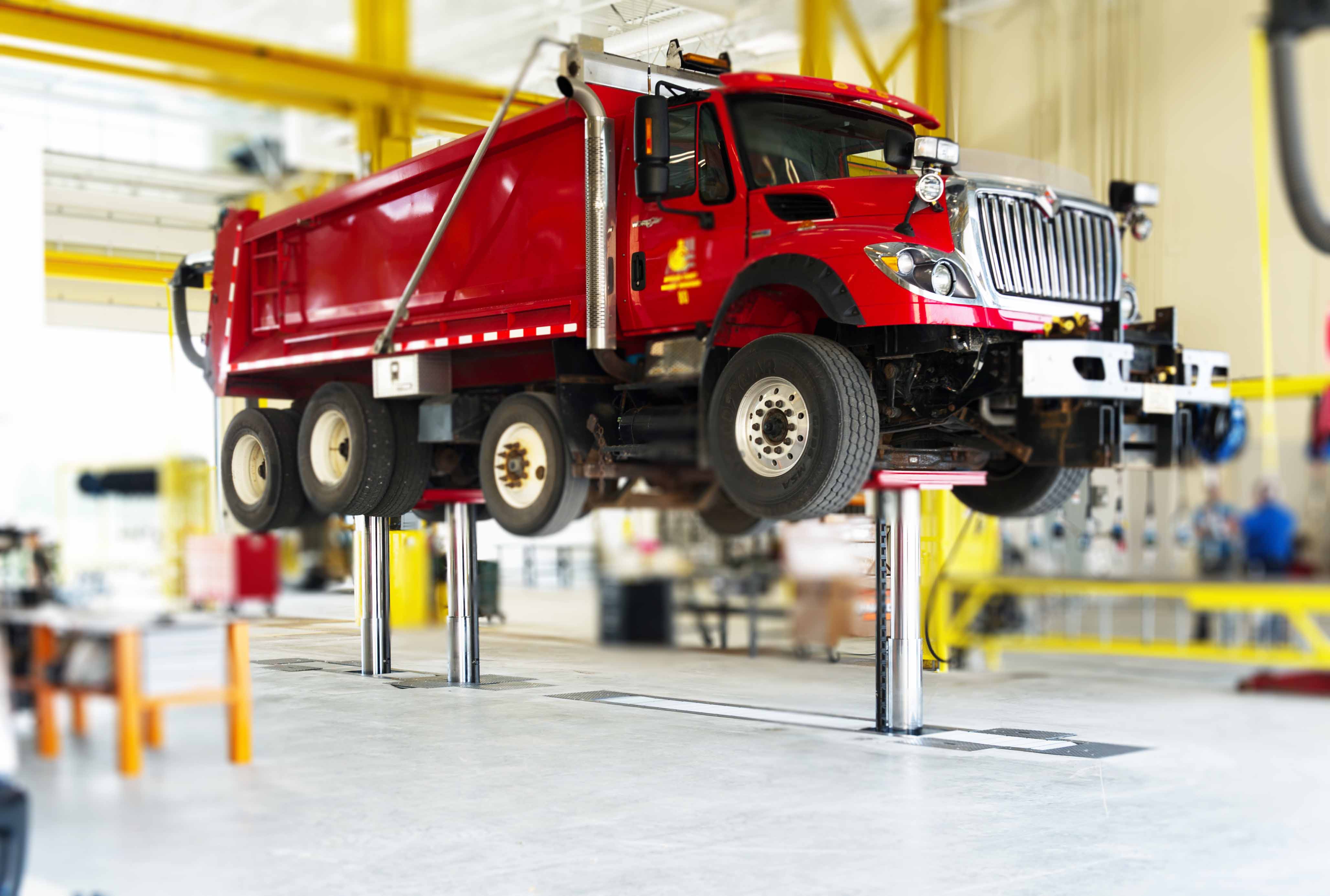 In-ground piston lifts enable wheels-free access to the vehicle.