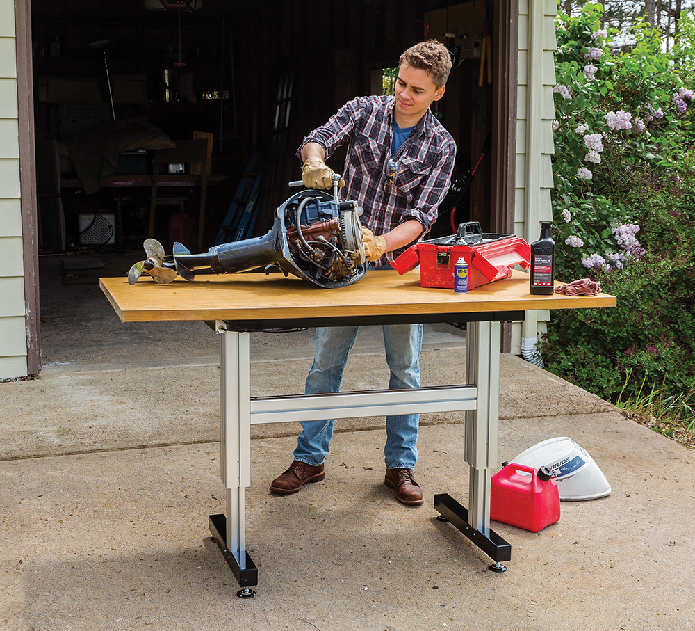 The Adjustable Height Work Station supports up to 500 lbs of weight, including the table top the user adds as their work surface.