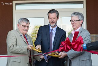 Dr. Ronnie Martin, dean of LUCOM (left), Jerry Falwell, president of Liberty University, and Dr. Thomas Eppes, president of CVFP, cut the ribbon at the opening of the Liberty Mountain Medical Group.