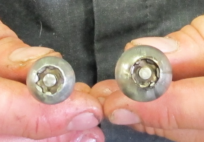 Machinists holding the first prototype on the left and the final lag bolt on the right.