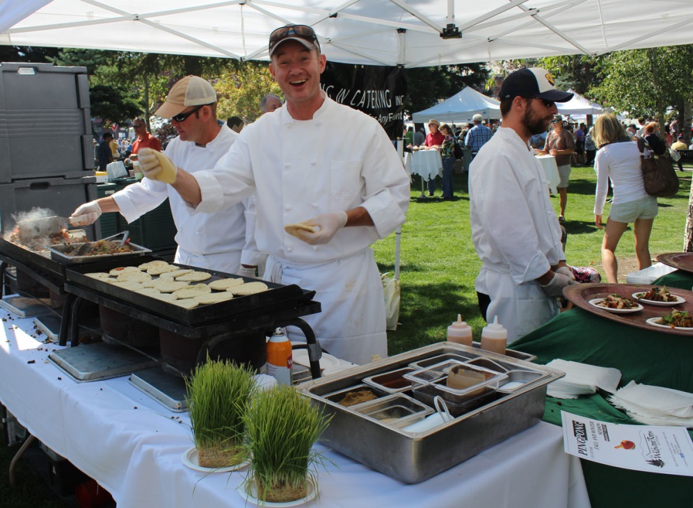 Local chefs from Taste of the Tetons demonstrate their culinary arts on Jackson Town Square (photo by Jackson Hole Chamber of Commerce).