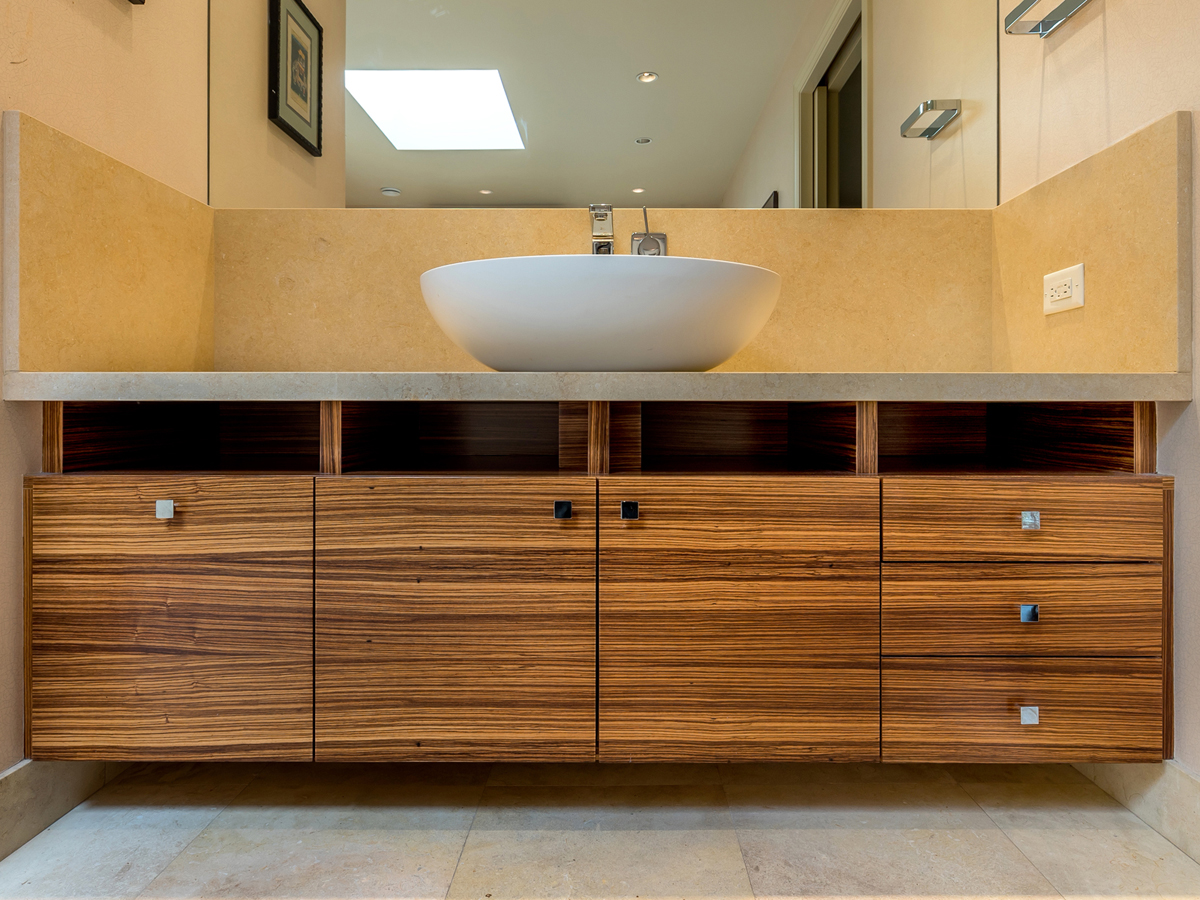 Wm. H. Fry Construction Co. won first place in the Residential Bath category in the 4th Annual PureBond® Quality Awards competition for its custom cabinetry featuring a zebrawood hardwood veneer.
