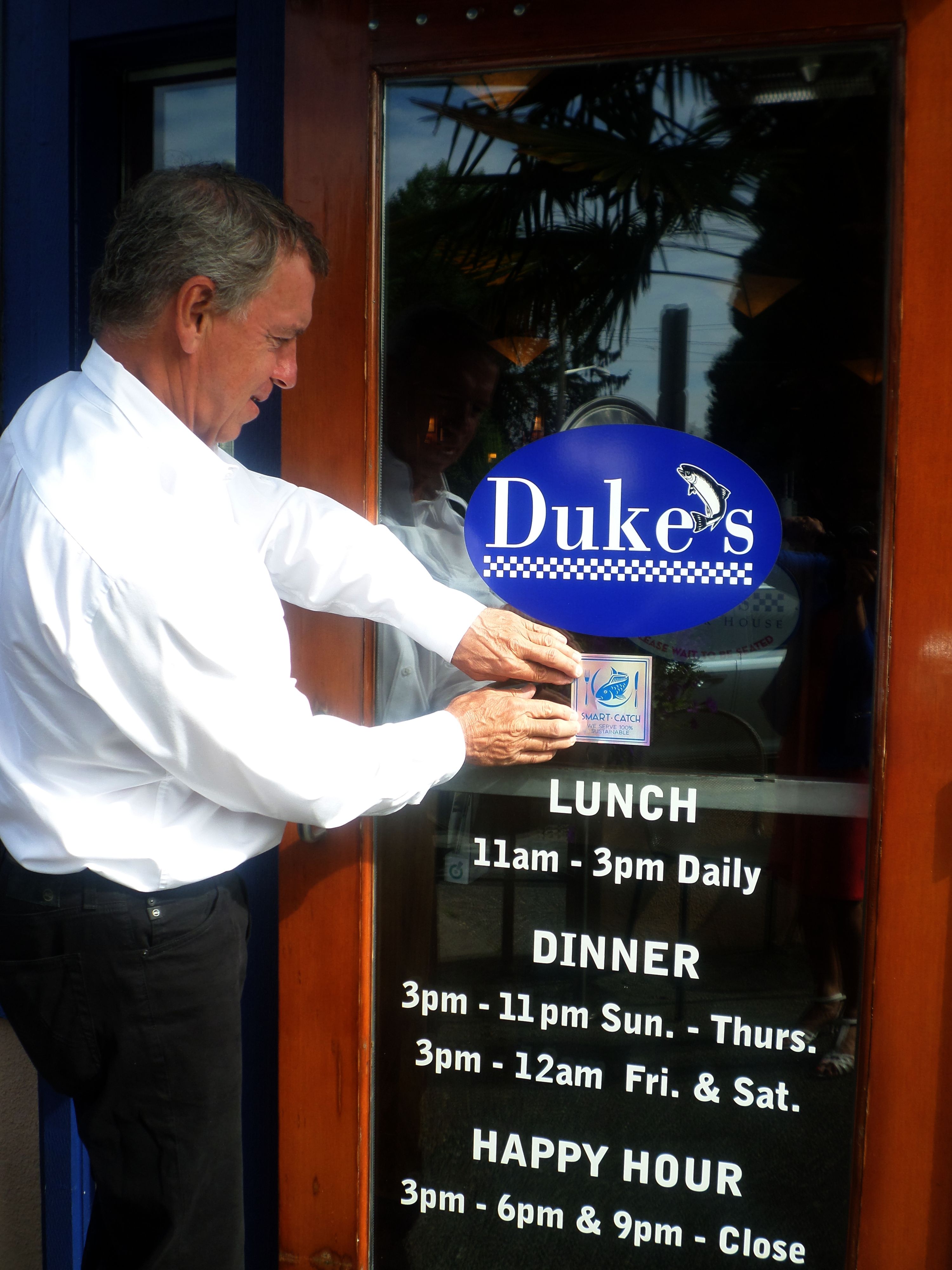 Duke Moscrip, Founder & CEO of Duke's Chowder House Applying Smart Catch Seal at Duke's Green Lake Location