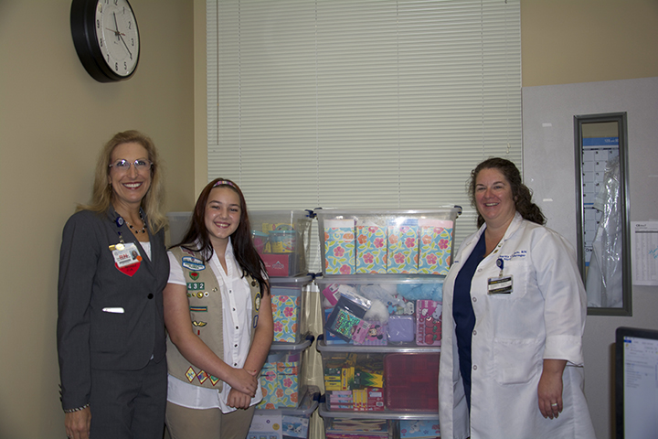 Girl Scout Ashlyn Baralt with Florida Hospital Carrollwood Chief Nursing Officer, Robin McGuinness and Emergency Department Manager, Charity Carlisle.