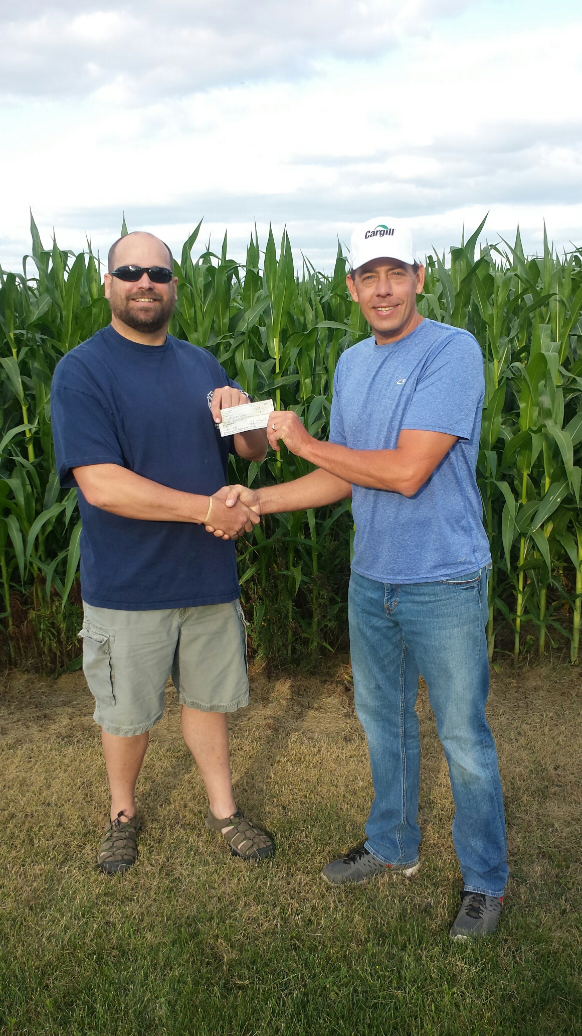 Cargill Donating Check -  Brandon Evans with the Badger Fire and Rescue  & Alan Viaene, Cargill Facility Manager at Fort Dodge.