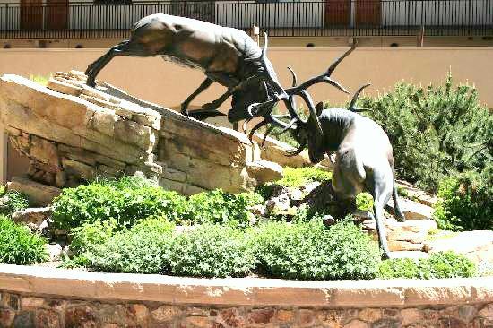 The hotel’s famous bronze sculpture of sparring elk greets guests in the Antlers at Vail’s Vail, Colo., courtyard.