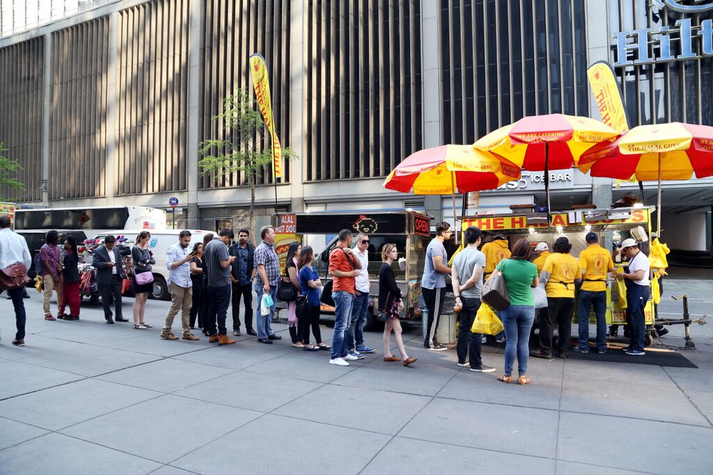 The famous never-ending line at The Halal Guys food cart