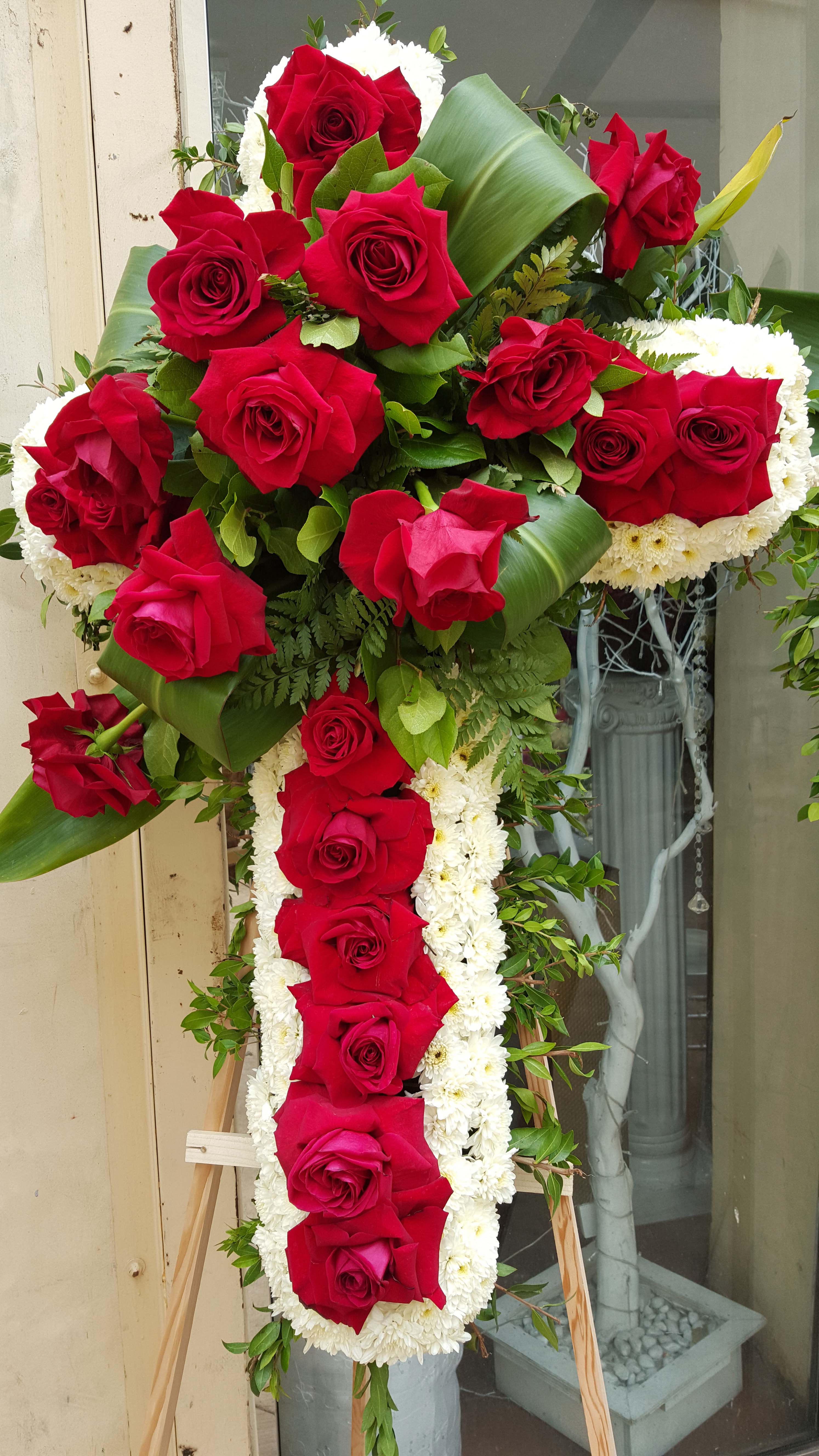 A funeral flower cross is popular for those of the Roman Catholic faith