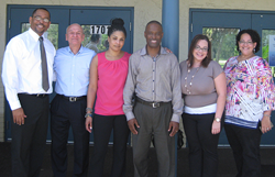Axiom Bank employees deliver hygiene kits and other donations to Rescue Outreach Mission.