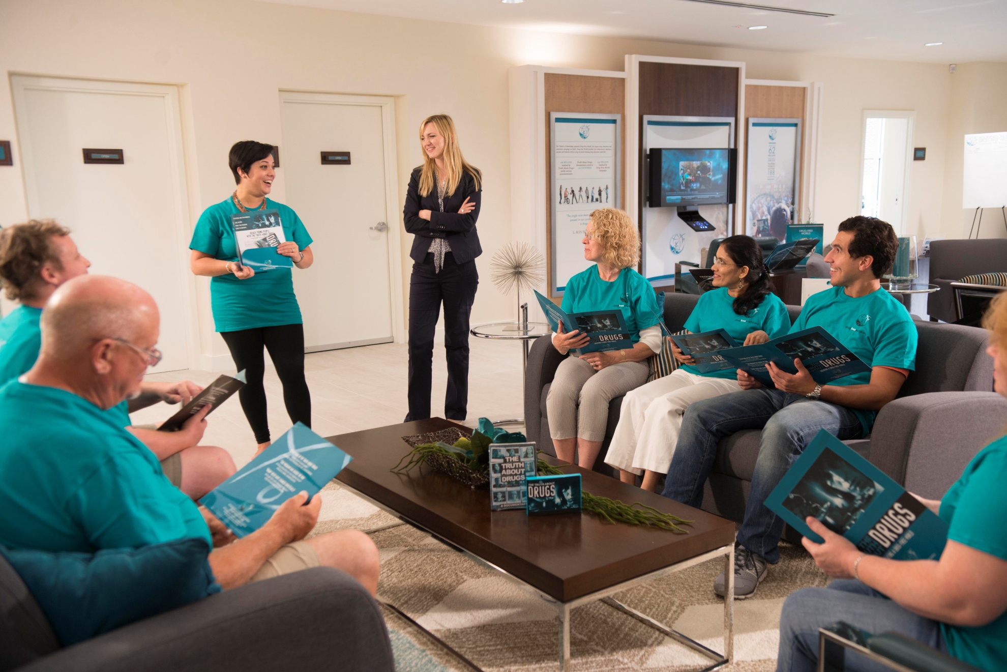 Volunteers meet at the Foundation for a Drug-Free World center in Clearwater, Florida, to plan activities to bring the program to the community.