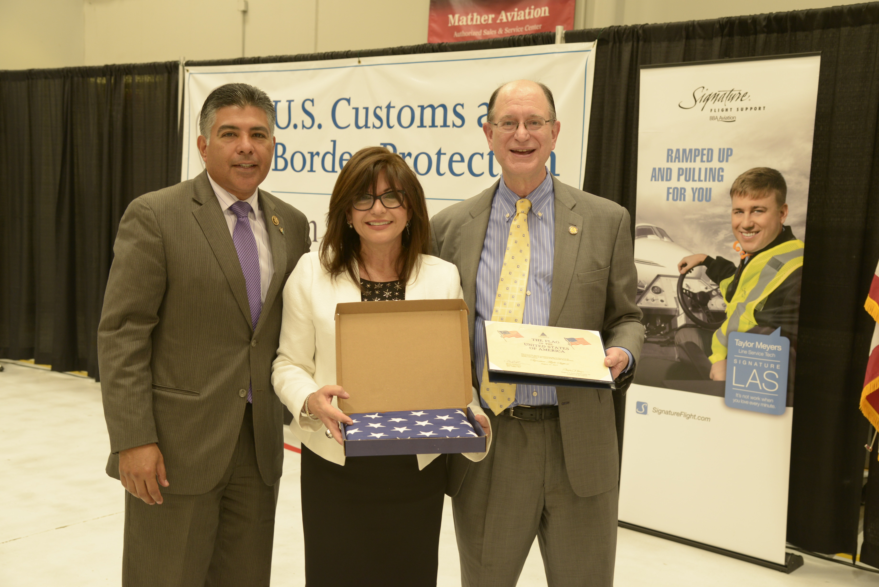 Congressmen Tony Cardenas and Brad Sherman with Signature Flight Support's CEO Maria Sastre