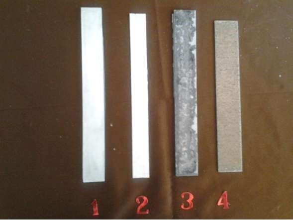 Recalls that after 60-90 minutes in solutions of KOH and NaOH oxide, film on plates #3 and # 4 stops the oxidation of the active metal, while plate #2 remains free of oxidation. (#1 is the control age