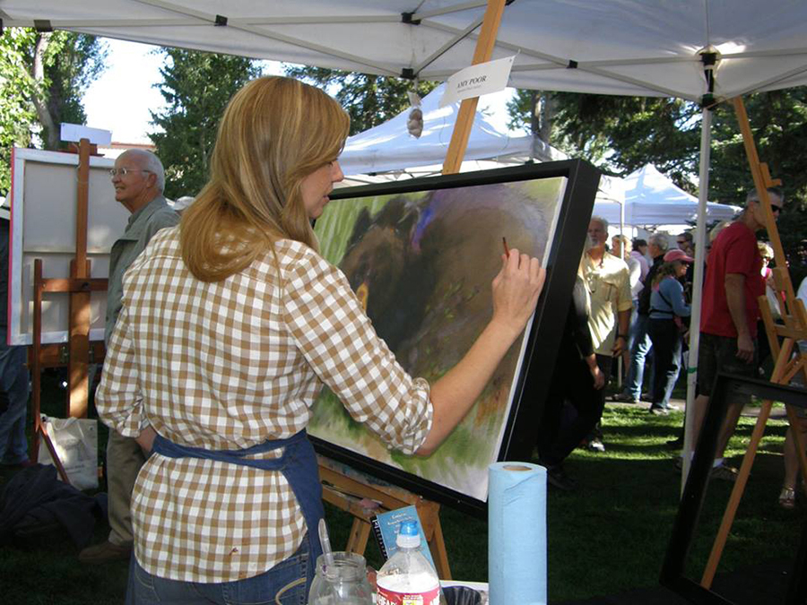 A QuickDraw artist paints in the open air during one of the festival’s most popular events, scheduled for Sept. 19, 2015, on Jackson Town Square.