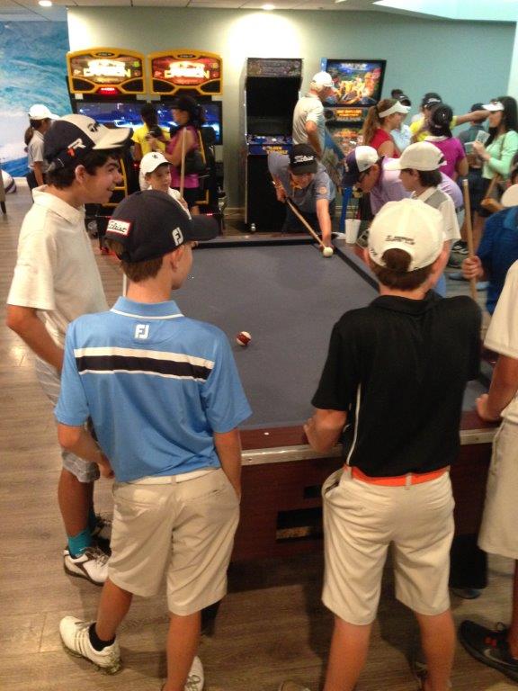 Kids enjoy the St.Andrews Country Club Rec Room during brief rain delay. Parents and kids were treated to a five-star barbeque and a ice cream served by a real Good Humor truck.