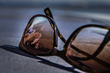 Sunglasses reflect Devlin and O'Sullivan as they soak up the Mediterranean sun