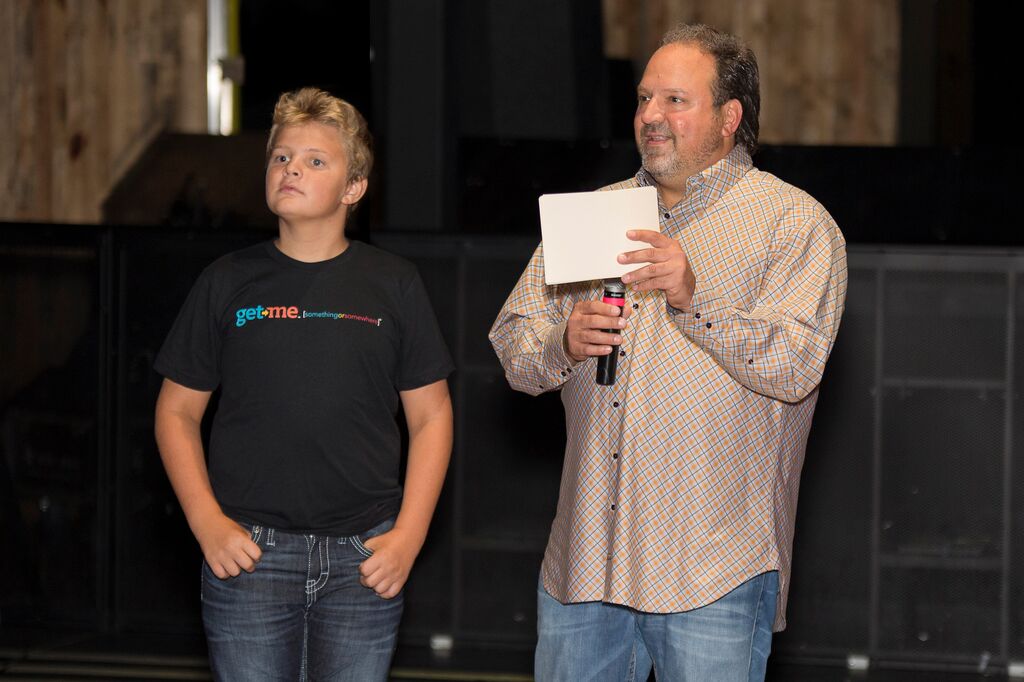 Get Me Founder, Michael Gaubert (pictured on right), and his son, Gannon (pictured left), during the VIP presentation at the August 20th Launch Event in Dallas, Texas
