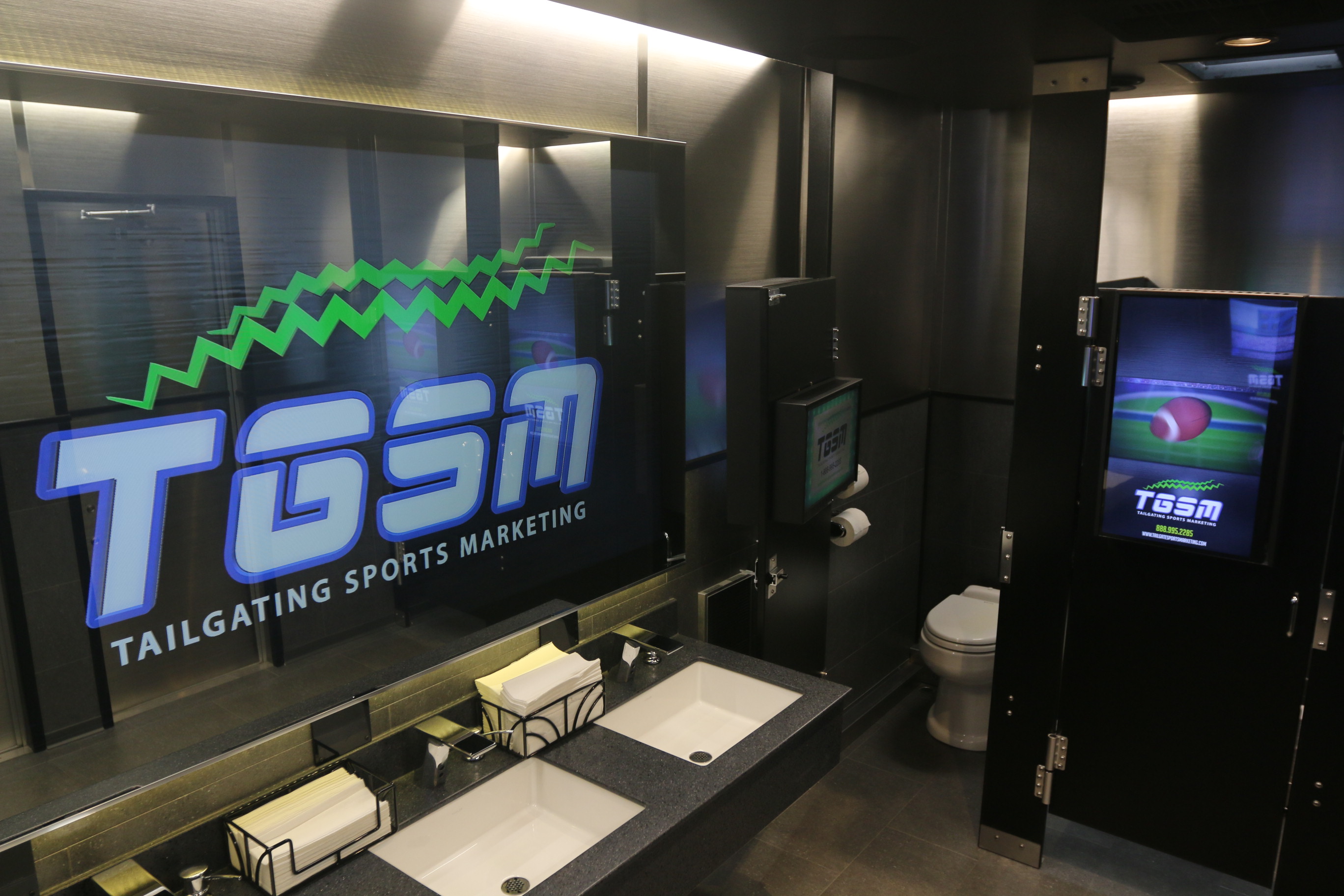 Interior shot of a digital interactive restroom trailer from Tailgating Sports Marketing.