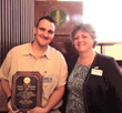 Jarett Rhoads (left) received service recognition plaque from NYSATA President Aimee Brunelle