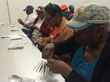 Senior citizens participate in a “What Happened Today?” community workshop, 2015. Photo by Blaize Middleton.