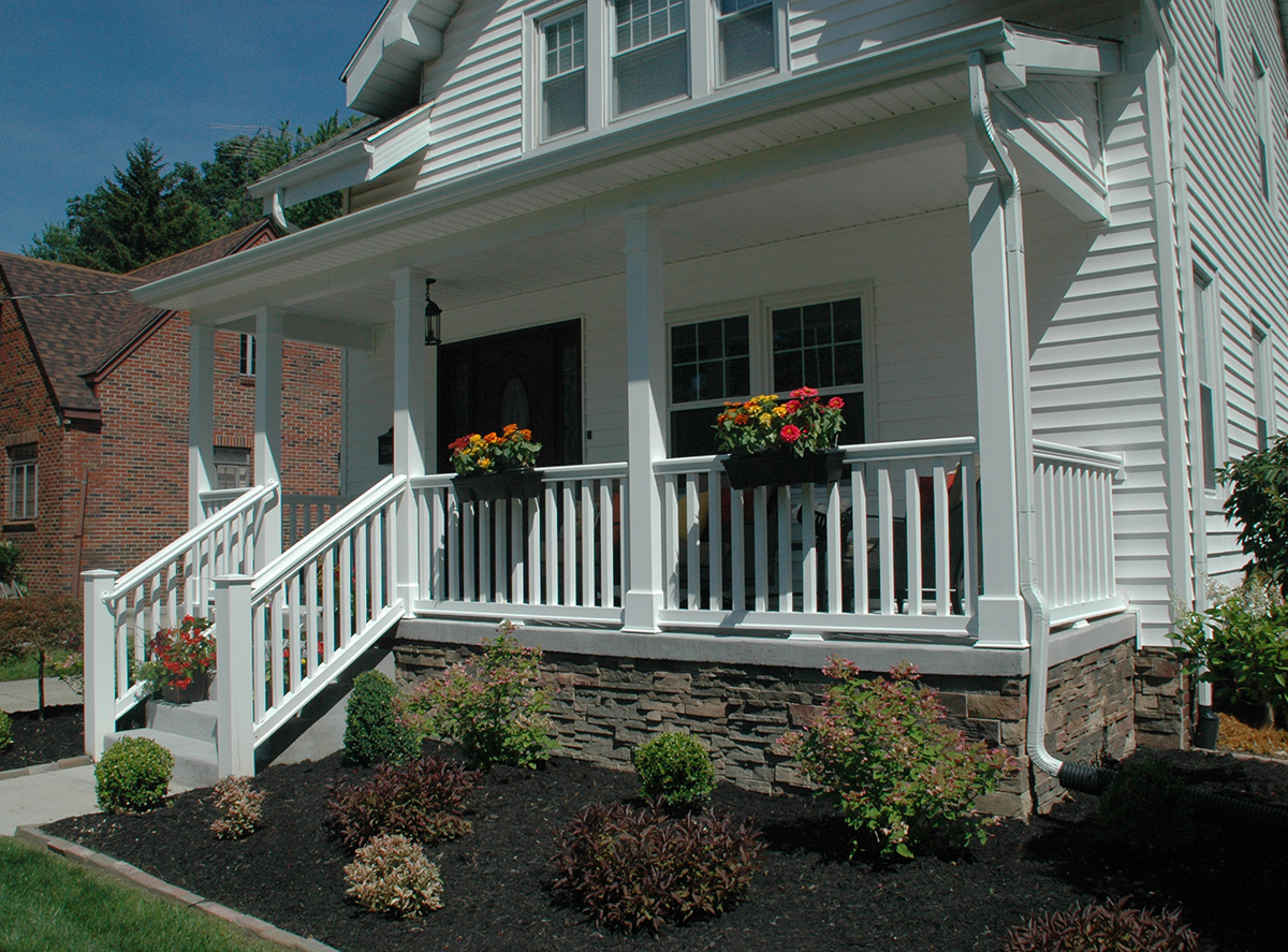 Low-maintenance polyurethane balustrade system from Fypon adds curb appeal to this porch.