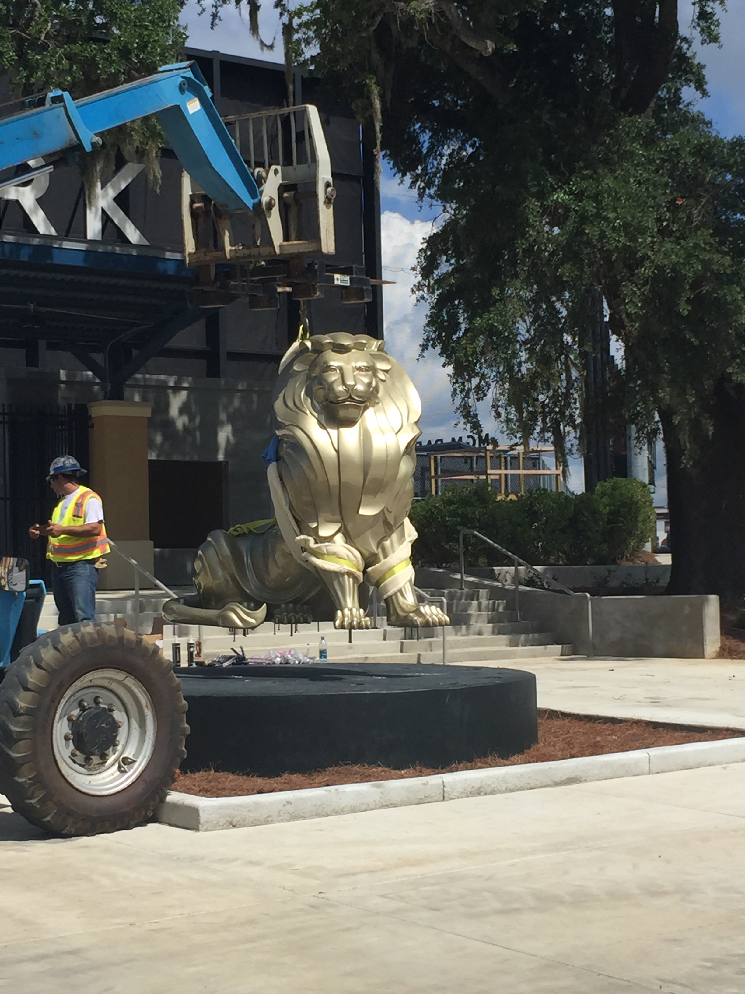 Lion being hoisted into position