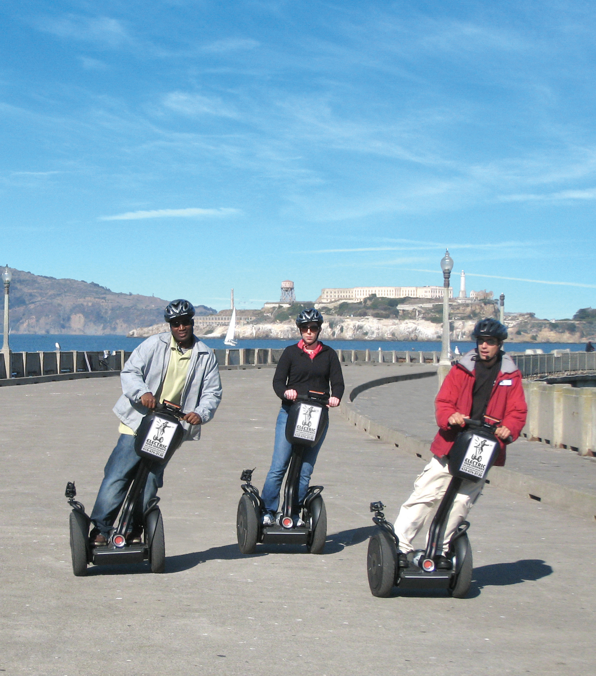 Segway tour on the Maritime Pier with Alcatraz in the background.